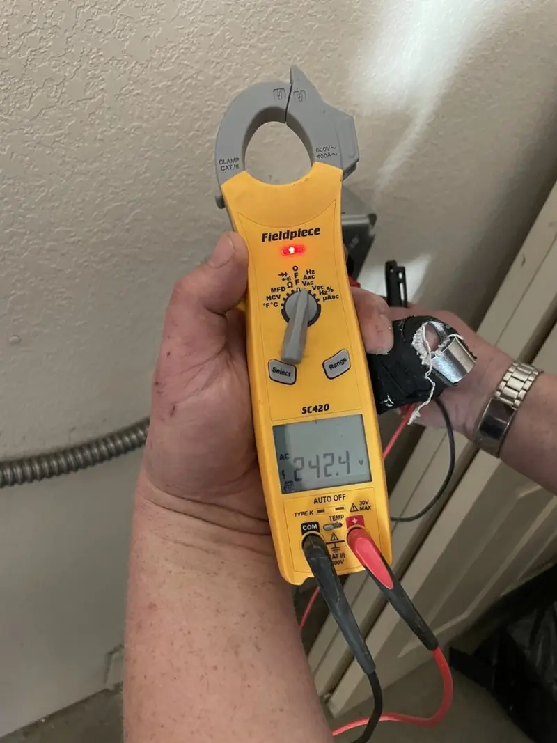 Voltage testing with clamp meter during Electrical Installation Services in Middleton